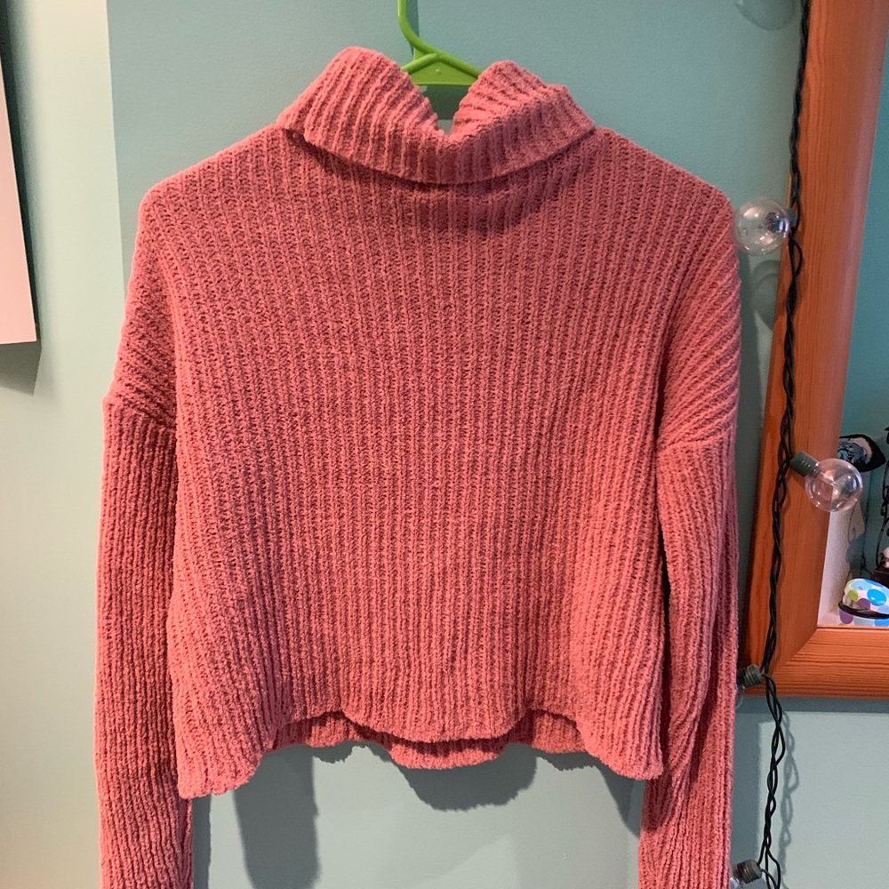 Tilly’s pink turtleneck